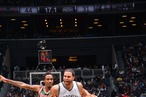 Deron Williams #8 of the Brooklyn Nets drives to the basket against Larry Sanders #8 of the Milwaukee Bucks during the game at the Barclays Center on December 9, 2012 in Brooklyn, New York.