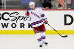 Dan Girardi #5 of the New York Rangers celebrates a third period goal in Game Three of the Eastern Conference Final against the New Jersey Devils during the 2012 NHL Stanley Cup Playoffs at the Prudential Center on May 19, 2012 in Ne