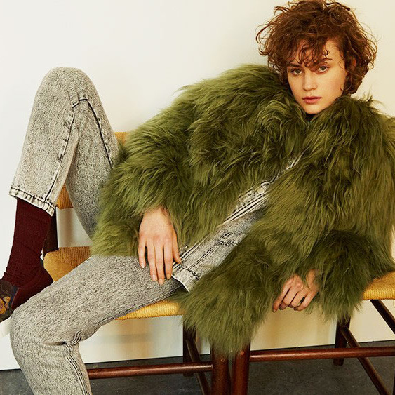 A woman wearing a shaggy coat and pants from French label Roseanna, featured in The Strategist's round up of emerging French designers to watch.