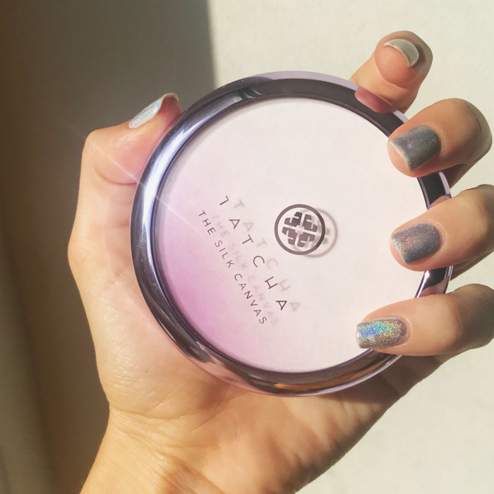 Rio Viera Newton holding her new Tatcha primer in her hand.
