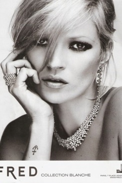 Kate Moss models her new jewelry.