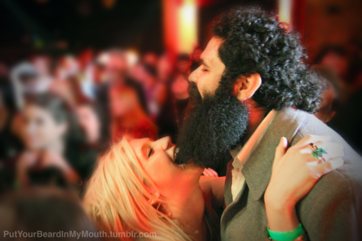 Yes, this is Ke$ha chewing on some poor man's bushy beard.