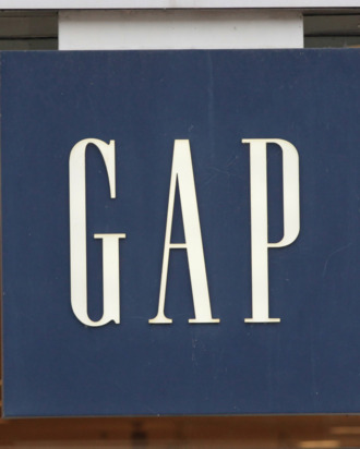CHICAGO, IL - OCTOBER 13: A sign hangs above the entrance of a GAP store on October 13, 2011 in Chicago, Illinois. Gap Inc. plans to reduce the number of Gap brand stores to 700 in North America, closing roughly one-third of their existing stores by the end of 2013.