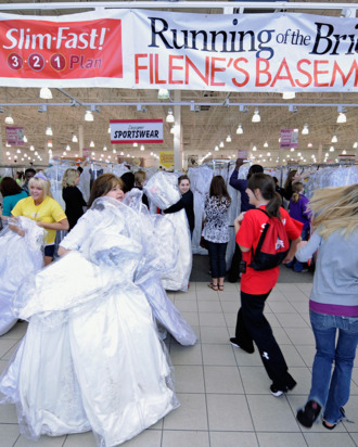 Participants of the Running of the Brides run in to Filene's Basement on May 20, 2011 in Columbus, Ohio. At Filene's Basement's Running of the Brides, Slim Fast, the brand known for helping millions of people slim down quickly, encouraged brides to get the perfect fit in the perfect dress. While waiting in line to rush the racks and purchase their dream dresses, Slim Fast entertained brides with fun bridal shower games. (Photo by Jamie Sabau/Getty Images for Slim-Fast)