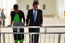 US President Barack Obama and First Lady Michelle Obama pay their respects at the USS Arizona Memorial at Pearl Harbor December 29, 2011 in Honolulu, Hawaii. AFP PHOTO/Mandel NGAN (Photo credit should read MANDEL NGAN/AFP/Getty Images)