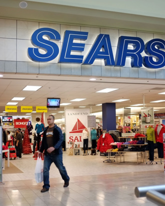 MILFORD, CT - DECEMBER 27: A man walks out of a Sears store on December 27, 2011 in Milford, Connecticut. Sears Holdings Corp has announced that it plans to close between 100 and 120 Sears and Kmart stores following poor sales during the holidays. (Photo by Spencer Platt/Getty Images)