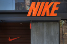 Nike Inc. signage is displayed outside of a store at the Third Street Promenade outdoor mall in Santa Monica, California, U.S, on Monday, Dec. 5, 2011. Since the Federal Reserve's last meeting early in November, reports on employment, manufacturing and retail sales have dispelled concerns the world's largest economy may slide back into recession.