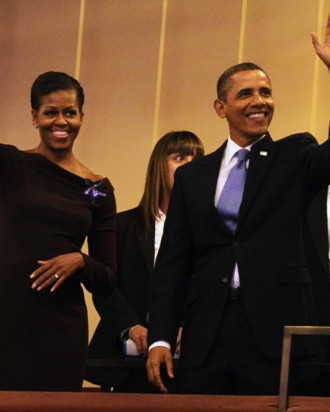 U.S. President Barack Obama and first lady Michelle Obama wave to guests as they arrive in their box at the Kennedy Center for the Performing Arts to attend the Let Freedom Ring Celebration on January 16, 2012 in Washington, DC.