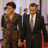 US President Barack Obama and First Lady Michelle Obama arrive to present the 2011 National Medal of Arts and Humanities Medal in the East Room at the White House in Washington, DC, on February 13, 2012.