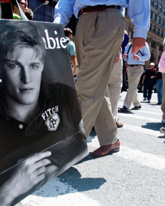 Shirtless male models outside of Abercrombie and Fitch