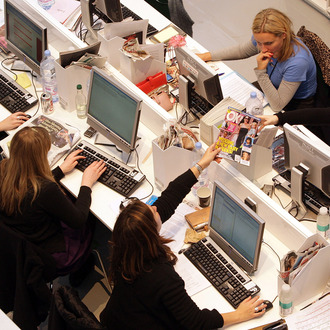 Production staff on the weekly fashion magazine, Grazia edit the magazine in a temporary office inside the Westfield shopping centre on November 3, 2008 in London. For one week Grazia magazine is being produced in the Westfield shopping centre and are offering shoppers free make-overs, fashion consultations and advice on pursuing a modeling career.