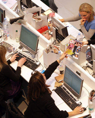 Production staff on the weekly fashion magazine, Grazia edit the magazine in a temporary office inside the Westfield shopping centre on November 3, 2008 in London. For one week Grazia magazine is being produced in the Westfield shopping centre and are offering shoppers free make-overs, fashion consultations and advice on pursuing a modeling career.