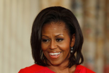 WASHINGTON, DC - NOVEMBER 21: First lady Michelle Obama introduces delivers opening ramarks during a student music program in the State Dining Room of the White House November 21, 2011 in Washington, DC. Part of a program called