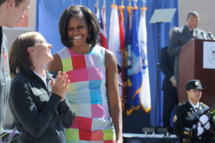 First lady Michelle†Obama, left, is escorted by Tech Sgt. Jordan Bishopp upon her arrival at Kirtland Air Force Base, in Albuquerque, N.M., on Tuesday, May 1, 2012. The visit was the last in a two-day, four-state campaign and fundraising swing through the region. (AP Photo/J.R. Oppenheim)