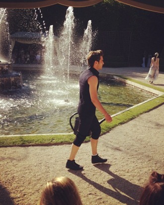 Male model with watering can bag.