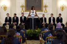 First lady Michelle Obama hosts a Let's Move! soccer event with students from across the country and the Major League Soccer champions LA Galaxy, Tuesday, May 15, 2012, in the State Dining Room of the White House in Washington. LA Galaxy players on the stage, from left are, Mike Magee, Sean Franklin, David Beckham, Landon Donovan, Todd Dunivant, A.J. DeLaGarza. (AP Photo/Carolyn Kaster)