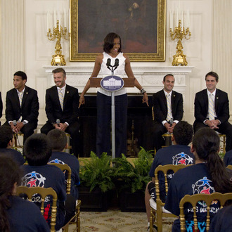 First lady Michelle Obama hosts a Let's Move! soccer event with students from across the country and the Major League Soccer champions LA Galaxy, Tuesday, May 15, 2012, in the State Dining Room of the White House in Washington. LA Galaxy players on the stage, from left are, Mike Magee, Sean Franklin, David Beckham, Landon Donovan, Todd Dunivant, A.J. DeLaGarza. (AP Photo/Carolyn Kaster)