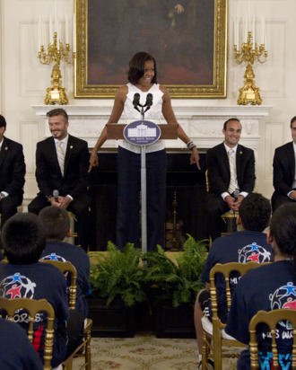 First lady Michelle Obama hosts a Let's Move! soccer event with students from across the country and the Major League Soccer champions LA Galaxy, Tuesday, May 15, 2012, in the State Dining Room of the White House in Washington. LA Galaxy players on the stage, from left are, Mike Magee, Sean Franklin, David Beckham, Landon Donovan, Todd Dunivant, A.J. DeLaGarza. (AP Photo/Carolyn Kaster)
