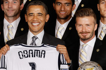 WASHINGTON, DC - MAY 15: U.S. President Barack Obama (L) poses for photographs with the Major League Soccer champions Los Angeles Galaxy and their mid-fielder David Beckham in the East Room of the White House May 15, 2012 in Washington, DC. Players from the Galaxy also participated in a