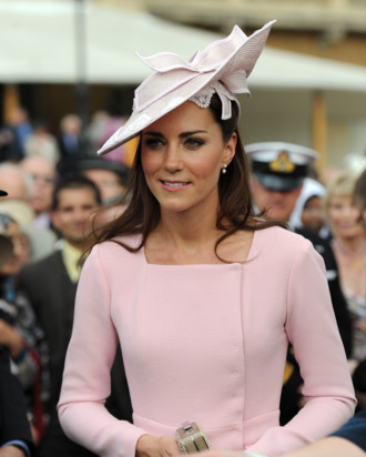 LONDON, UNITED KINGDOM - MAY 29: Catherine, Duchess of Cambridge meets guests during a garden party at Buckingham Palace on May 29, 2012 in London, England. (Photo by Anthony Devlin - WPA Pool /Getty Images)