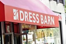 Pedestrians pass by a Dress Barn store in New York, U.S. on Wednesday, Sept. 19, 2007. Dress Barn Inc., the women's clothing retailer with 1,428 stores, rose as much as 8.3 percent in U.S. trading after reporting fourth-quarter profit that exceeded analysts' estimates. Photographer: Stephen Hilger/Bloomberg News