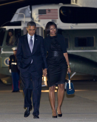 President Barack Obama and first lady Michelle Obama walks from Marine One to board Air Force One at John F. Kennedy International Airport, Friday, June 15, 2012, in Andrews Air Force Base, Md., en route Washington.