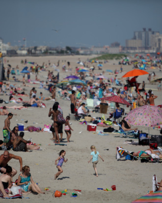 The crowds tend to gather near 92nd St. at Rockaway Beach like this day on Sunday, June 20, 2011.