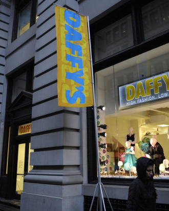 Shoppers walk past Daffy's, a fashion brand name discount chain store, in New York, December 11, 2008.