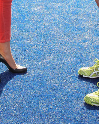 A picture shows the shoes of Britain's Catherine, Duchess of Cambridge (L) and women's Team GB hockey captain Kate Walsh (R) as they talk during a visit by the duchess to the Riverside Arena at the Olympic Park in London on March 15, 2012.