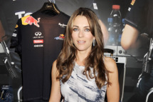 LONDON, ENGLAND - JULY 05: (EMBARGOED FOR PUBLICATION IN UK TABLOID NEWSPAPERS UNTIL 48 HOURS AFTER CREATE DATE AND TIME. MANDATORY CREDIT PHOTO BY DAVE M. BENETT/GETTY IMAGES REQUIRED) Elizabeth Hurley attends the launch of the Geox pop-up shop offering limited edition replicas of the official Geox-Red Bull Racing driver's boots at Harrods on July 5, 2011 in London, England. (Photo by Dave M. Benett/Getty Images)