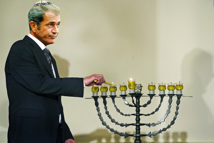 David Ben-Gurion's grandson Yariv Ben-Eliezer lights the Menorah during the Hanukkah reception at White House in Washington, DC, December 15, 2008. AFP PHOTO/Jim WATSON (Photo credit should read JIM WATSON/AFP/Getty Images)