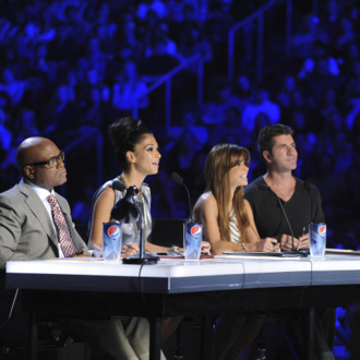 THE X FACTOR: THE X FACTOR is the new competition series that gives viewers the opportunity to help choose the next global superstar or breakout music group. Judges Simon Cowell, Paula Abdul, L.A. Reid and Nicole Scherzinger will travel the nation searching for undiscovered talent. Hosted by Steve Jones, the two-night series premiere will showcase the live auditions which took place in front of audiences of thousands, around the country Wednesday, Sept. 21 (8:00-10:00 PM ET/PT) and Thursday, Sept. 22 (8:00-10:00 PM ET/PT) on FOX. Pictured L-R: L.A. Reid, Nicole Scherzinger, Paula Abdul and Simon Cowell. CR: Ray Mickshaw / FOX.