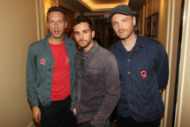 LONDON, ENGLAND - OCTOBER 24: (UK TABLOID NEWSPAPERS OUT) Jonny Buckland, Chris Martin and Guy Berryman of Coldplay pose in the press room with their Best Act in the World Today Award at The 2011 Q Awards at The Grosvenor House Hotel on October 24, 2011 in London, United Kingdom. (Photo by Dave Hogan/Getty Images)