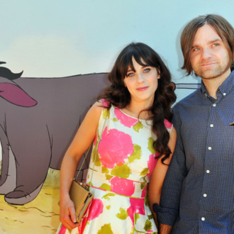 Actress/singer Zooey Deschanel and musician Ben Gibbard arrive at Walt Disney Pictures presents the premiere of
