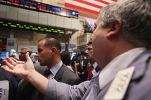 NEW YORK, NY - NOVEMBER 01: Traders work on the floor of the New York Stock Exchange before the closing bell on November 1, 2011 in New York City. U.S. stocks and global markets fell sharply Tuesday following news that Greece's prime minister has called for an unexpected public vote to approve Europe's debt deal. The Dow Jones industrial average (INDU) finished 297 points lower. Leaders of France and Germany, the architects of the Greek rescue plan, have scheduled an emergency meeting after Greek Prime Minister George Papandreou called for the referendum. (Photo by Spencer Platt/Getty Images)