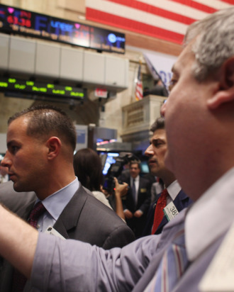 NEW YORK, NY - NOVEMBER 01: Traders work on the floor of the New York Stock Exchange before the closing bell on November 1, 2011 in New York City. U.S. stocks and global markets fell sharply Tuesday following news that Greece's prime minister has called for an unexpected public vote to approve Europe's debt deal. The Dow Jones industrial average (INDU) finished 297 points lower. Leaders of France and Germany, the architects of the Greek rescue plan, have scheduled an emergency meeting after Greek Prime Minister George Papandreou called for the referendum. (Photo by Spencer Platt/Getty Images)