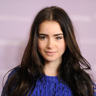 BEVERLY HILLS, CA - DECEMBER 07: Actress Lily Collins arrives at The Hollywood Reporter's Annual