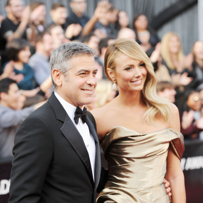 Actor George Clooney (L) and Stacy Kiebler arrive at the 84th Annual Academy Awards