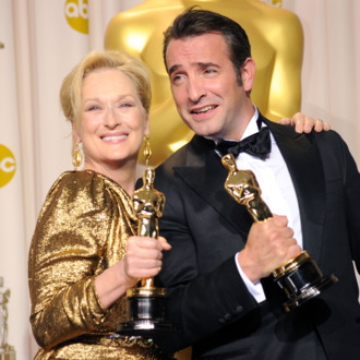 HOLLYWOOD, CA - FEBRUARY 26: Actress Meryl Streep (L), winner of the Best Actress Award for 'The Iron Lady,' and actor Jean Dujardin, winner of the Best Actor Award for 'The Artist,' pose in the press room at the 84th Annual Academy Awards held at the Hollywood & Highland Center on February 26, 2012 in Hollywood, California. (Photo by Jason Merritt/Getty Images)