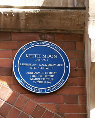 A wall plaque unveiled by British singer Roger Daltrey (unseen) is pictured high on the wall at 90 Wardour Street in London on March 8, 2009, in honour of the late Keith Moon, drummer for the rock band 'The Who', who died in 1978. AFP PHOTO/MAX NASH (Photo credit should read MAX NASH/AFP/Getty Images)