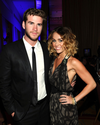 Actress/singer Miley Cyrus and Liam Hemsworth backstage during Muhammad Ali's Celebrity Fight Night XVIII held at JW Marriott Desert Ridge Resort & Spa on March 24, 2012 in Phoenix, Arizona.