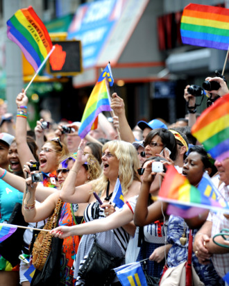 Spectators cheer during the New York City gay pride march June 26, 2011.