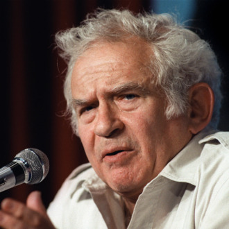 (FILES) File picture of US writer Norman Mailer addressing the media, 19 May 1987 in Cannes during a press conference as member of the jury of the 40th Cannes film festival. Norman Mailer, famed for his first novel