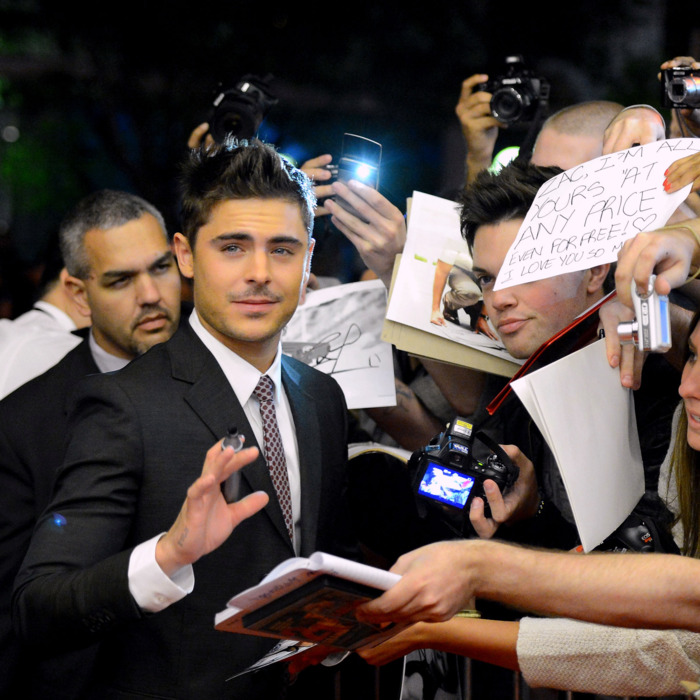 Zac Efron signs autographs at the