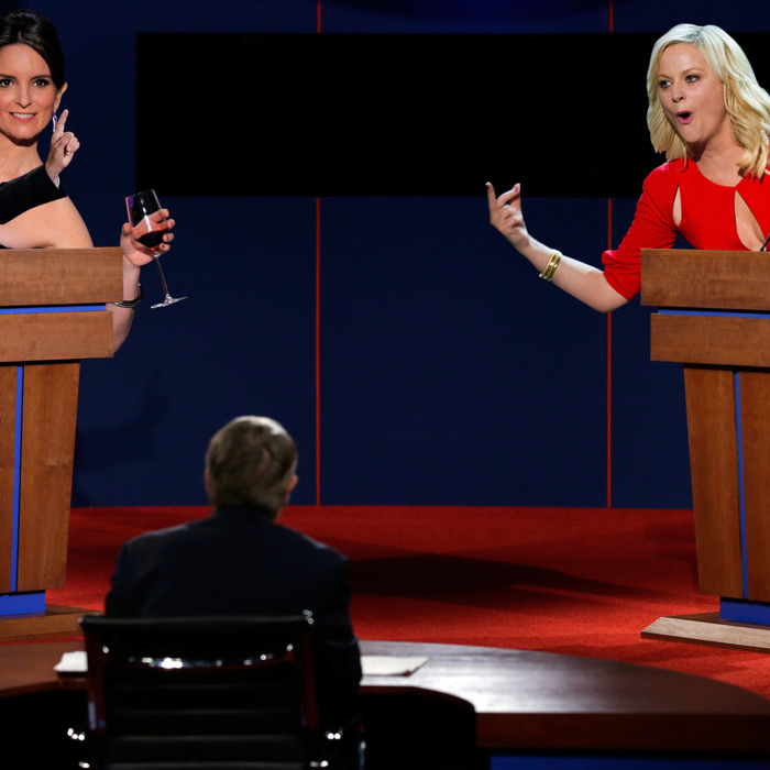 Republican presidential nominee Mitt Romney answers a question as President Barack Obama listens during the first presidential debate at the University of Denver, Wednesday, Oct. 3, 2012, in Denver. (AP Photo/Charlie Neibergall)