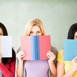 Women hiding behind books