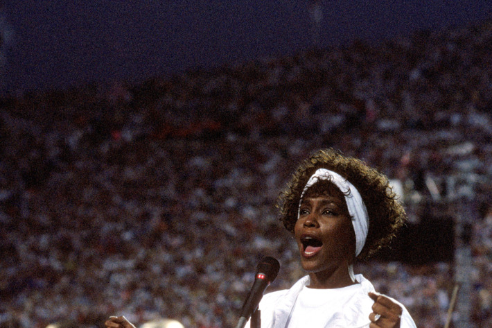 Whitney Houston sings the National Anthem before a game with the New York Giants taking on the Buffalo Bills prior to Super Bowl XXV at Tampa Stadium on January 27, 1991 in Tampa, Florida. The Giants won 20-19.