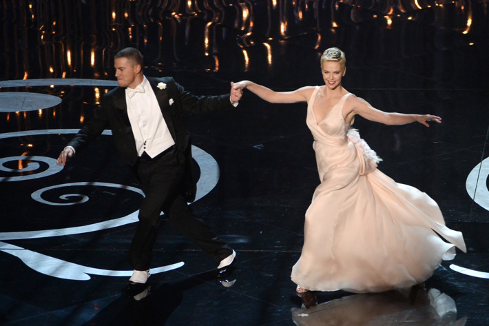HOLLYWOOD, CA - FEBRUARY 24: Actor Channing Tatum and actress Charlize Theron dance onstage during the Oscars held at the Dolby Theatre on February 24, 2013 in Hollywood, California. (Photo by Kevin Winter/Getty Images)