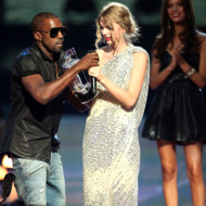 Kayne West (L)jumps onstage after Taylor Swift (C) won the "Best Female Video" award the 2009 MTV Video Music Awards at Radio City Music Hall on September 13, 2009 in New York City.