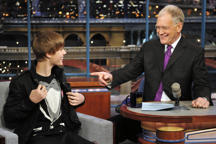 Justin Bieber, left, shows Dave his tuxedo shirt on the Late Show with David Letterman, Monday Jan. 31, 2011 on the CBS Television Network.Photo: John Paul Filo/CBS?2011 CBS Broadcasting Inc. All Rights Reserved